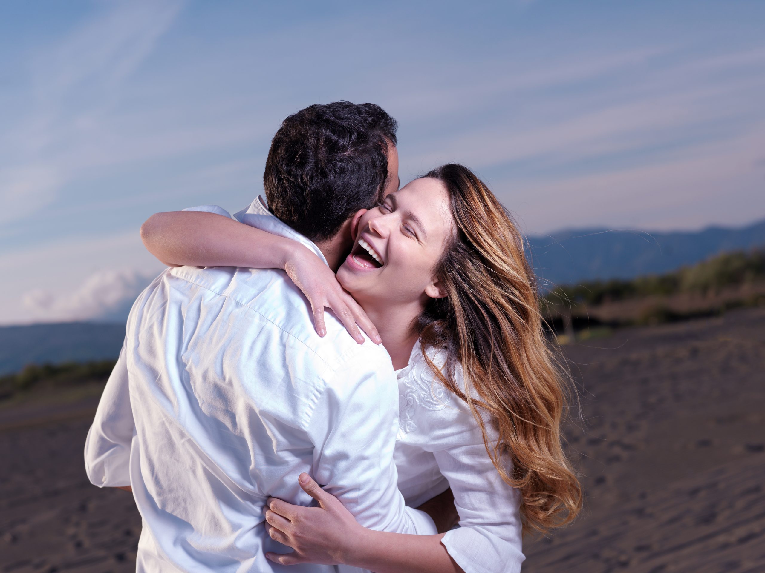 A couple smiling after an intensive marriage retreat